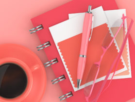 3d render of stationery with textile color swatch lying on desk. Living coral. Color of the year 2019.